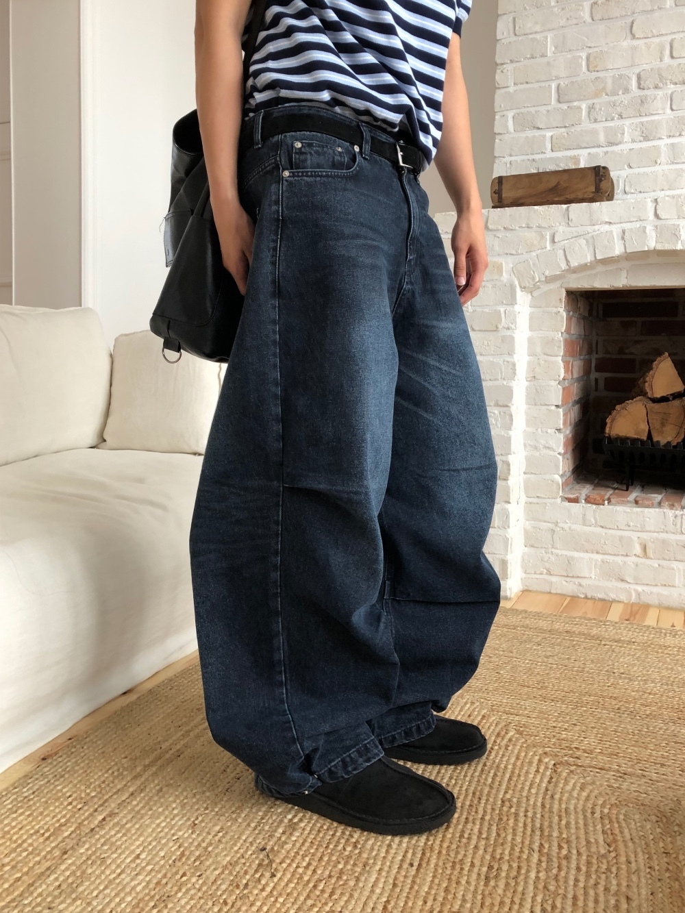 水洗彎刀牛仔褲