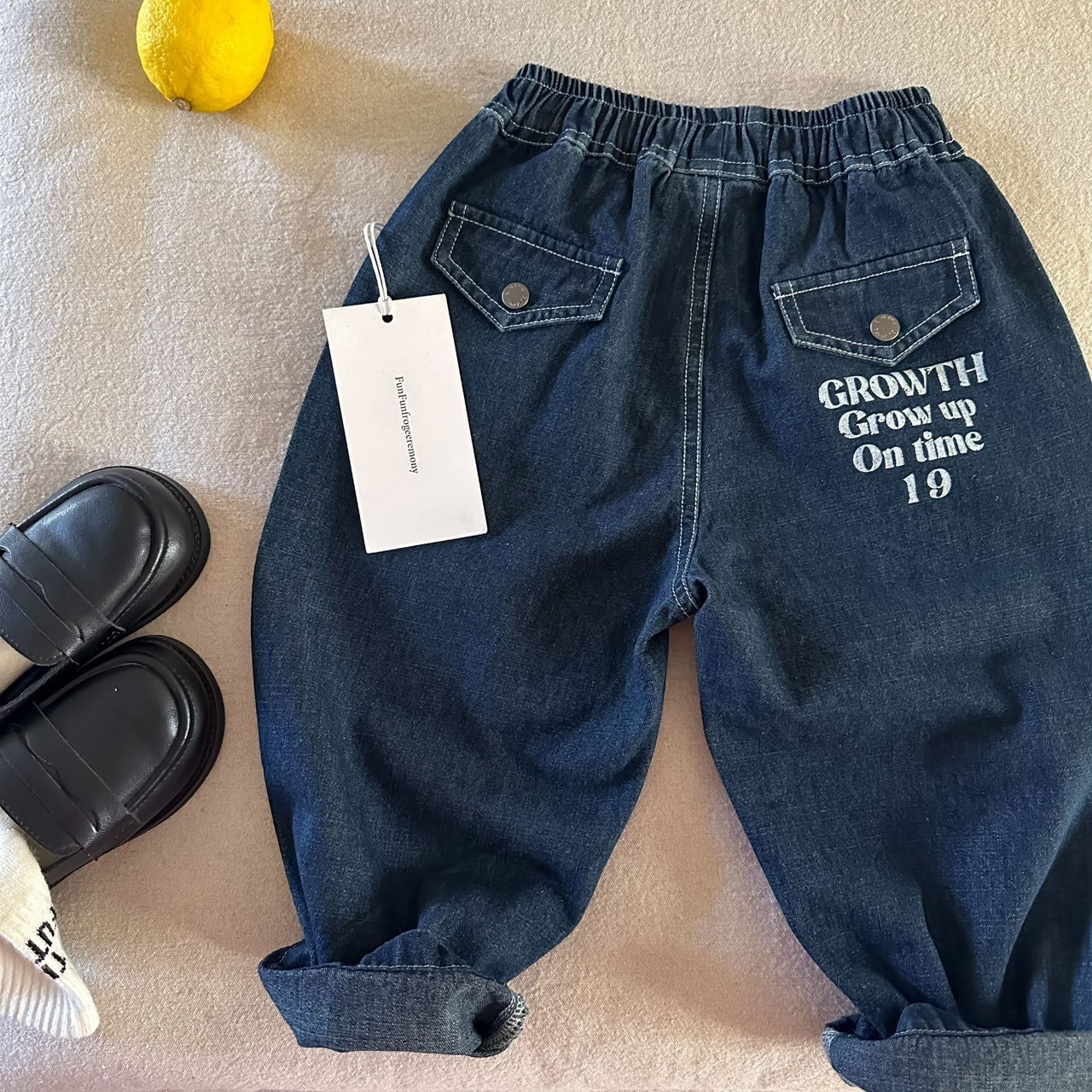 假口袋字母牛仔褲