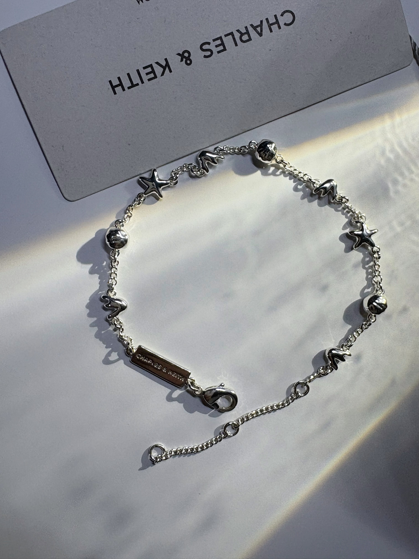 代購-CHARLES&KEITH 小ck 夏日度假風 情人節限定 貝殼海星 黃銅 手鍊 Silver銀色