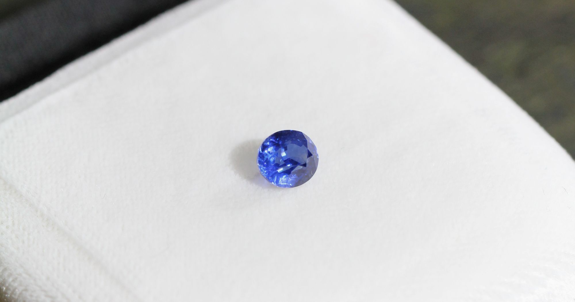 A royal blue oval brilliant-cut sapphire.
