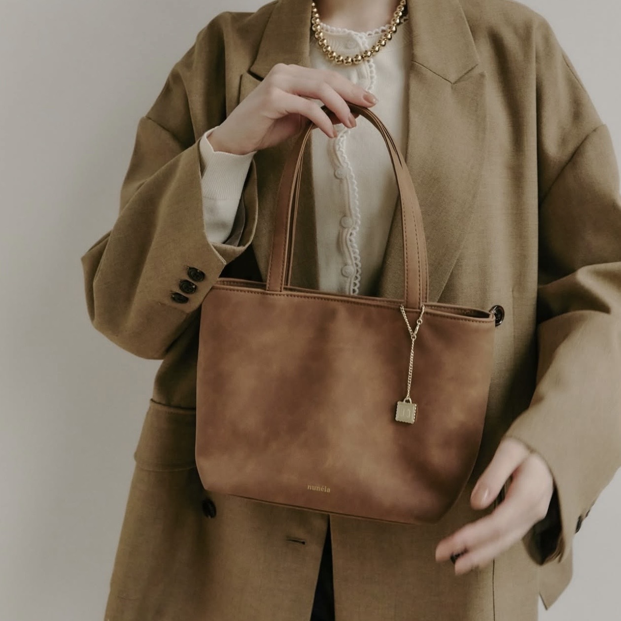nunela 小金釦手提包