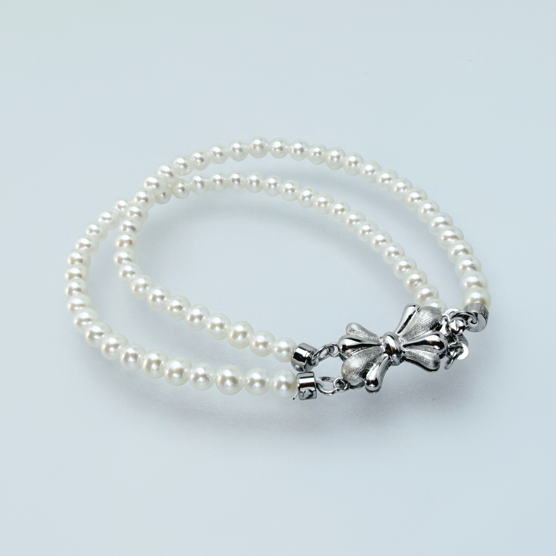 小米珍珠雙手鏈配蝴蝶扣