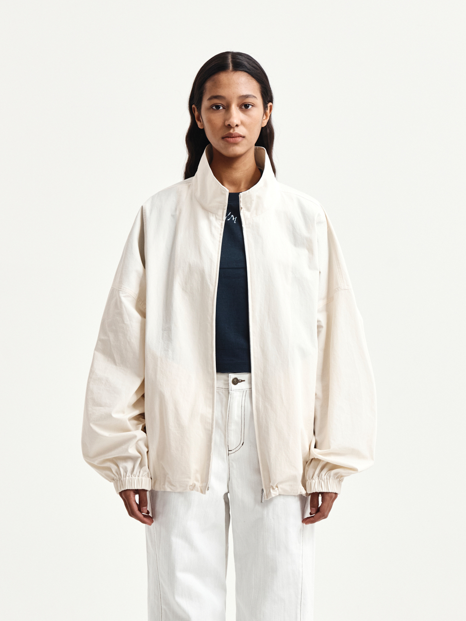 BACK LOGO HIGH NECK JUMPER IN CREAM