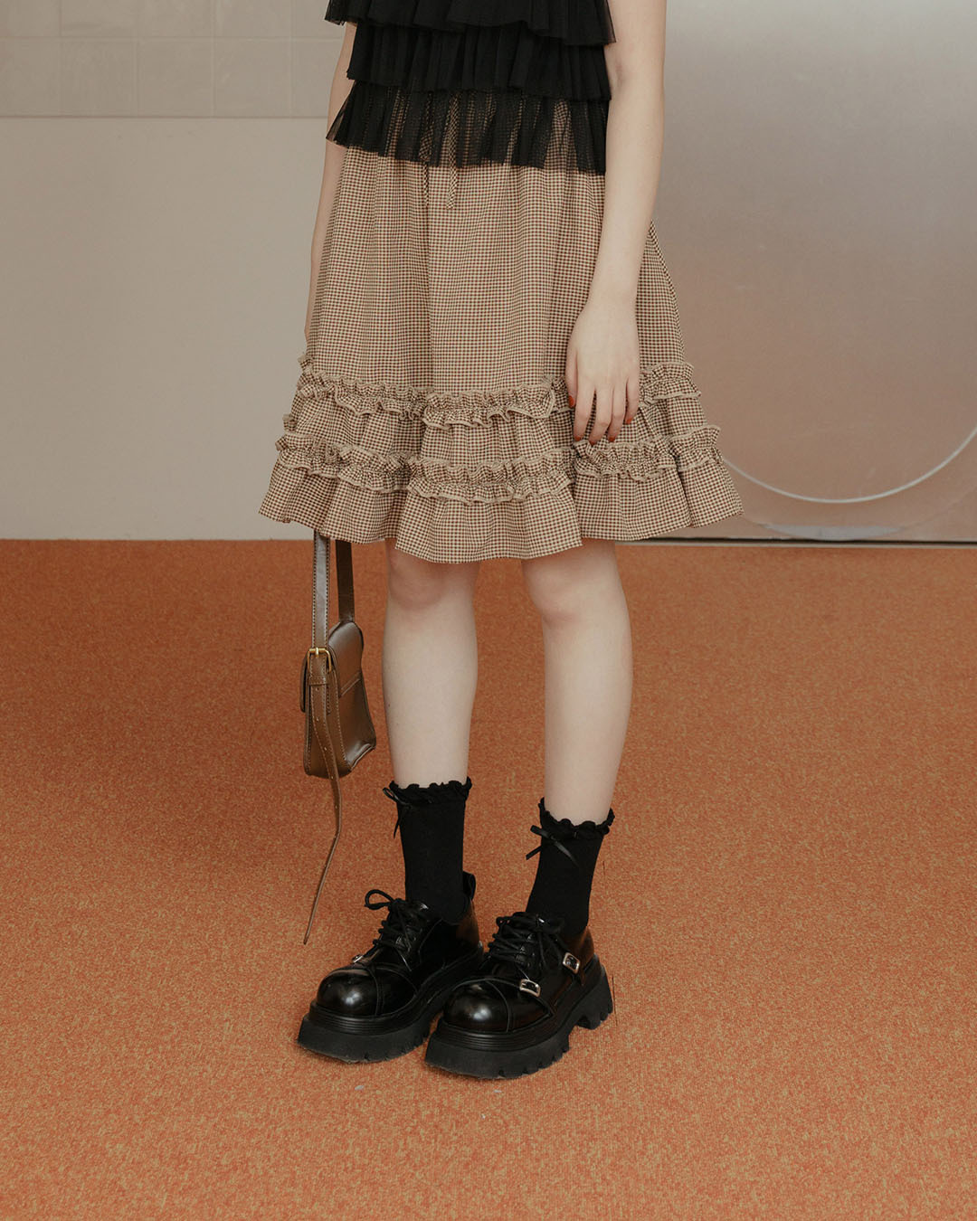 Plaid ruffled five-quarter skirt with tie detail, available in two colors.【03010946】in stock+pre-order