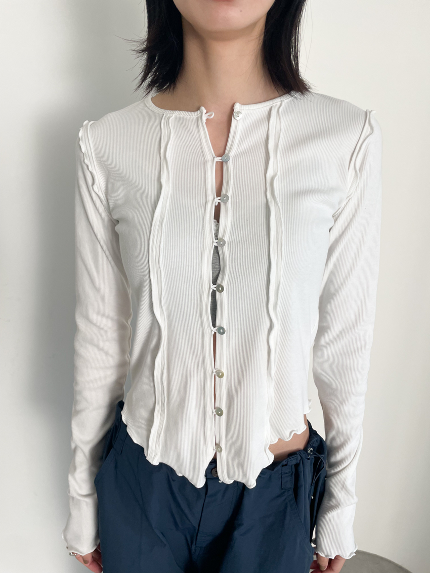 curved ruffle hem button top