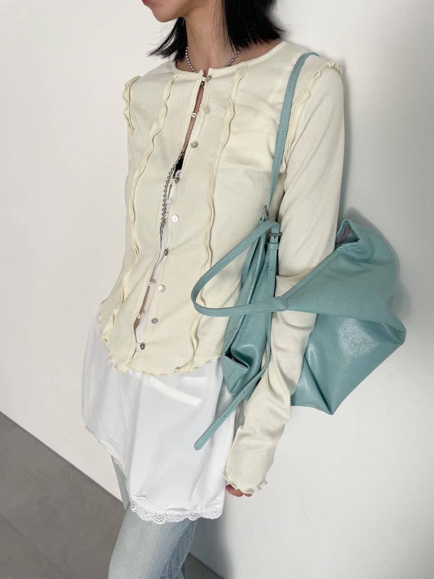 curved ruffle hem button top