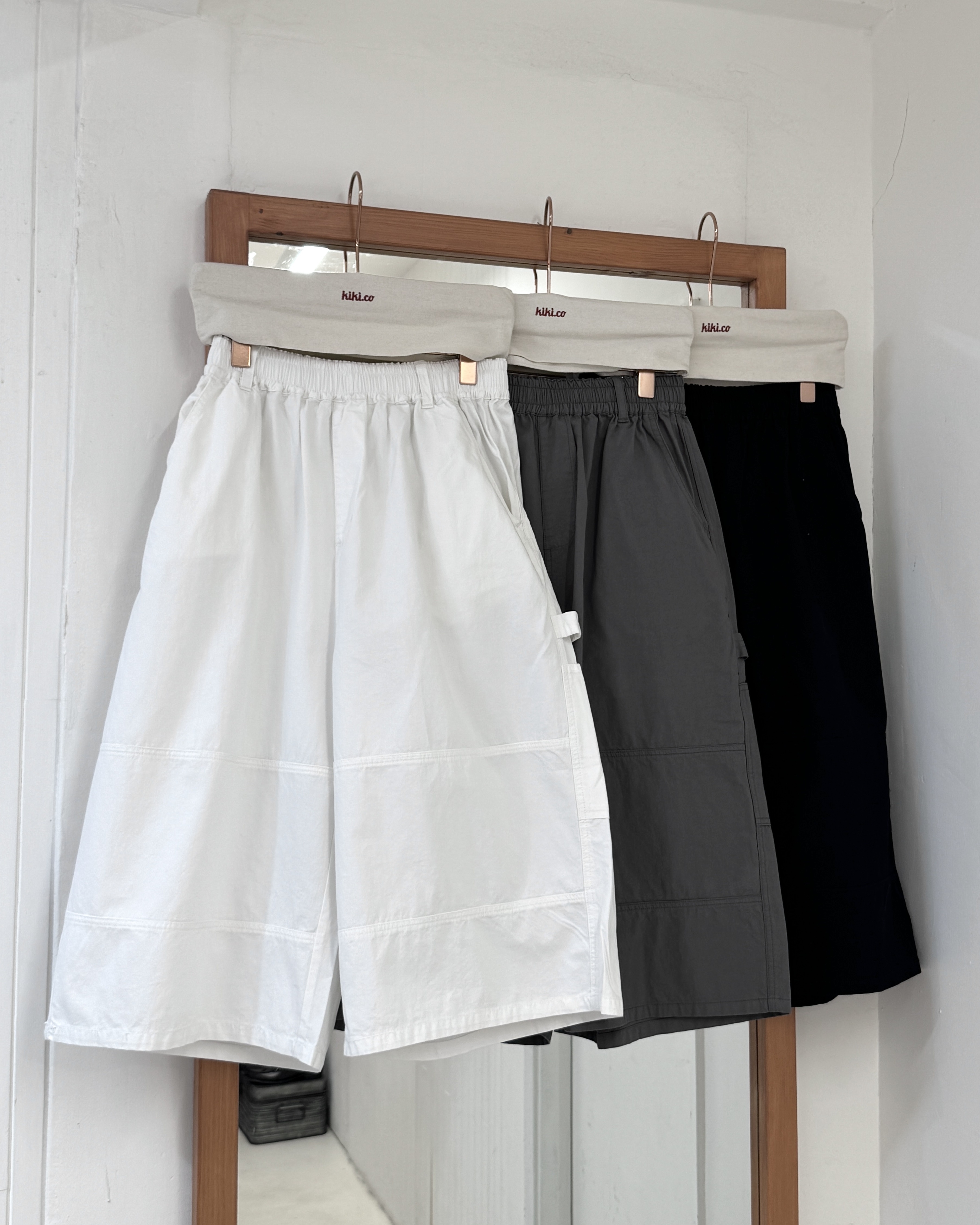 全橡筋束繩左側口袋中長褲