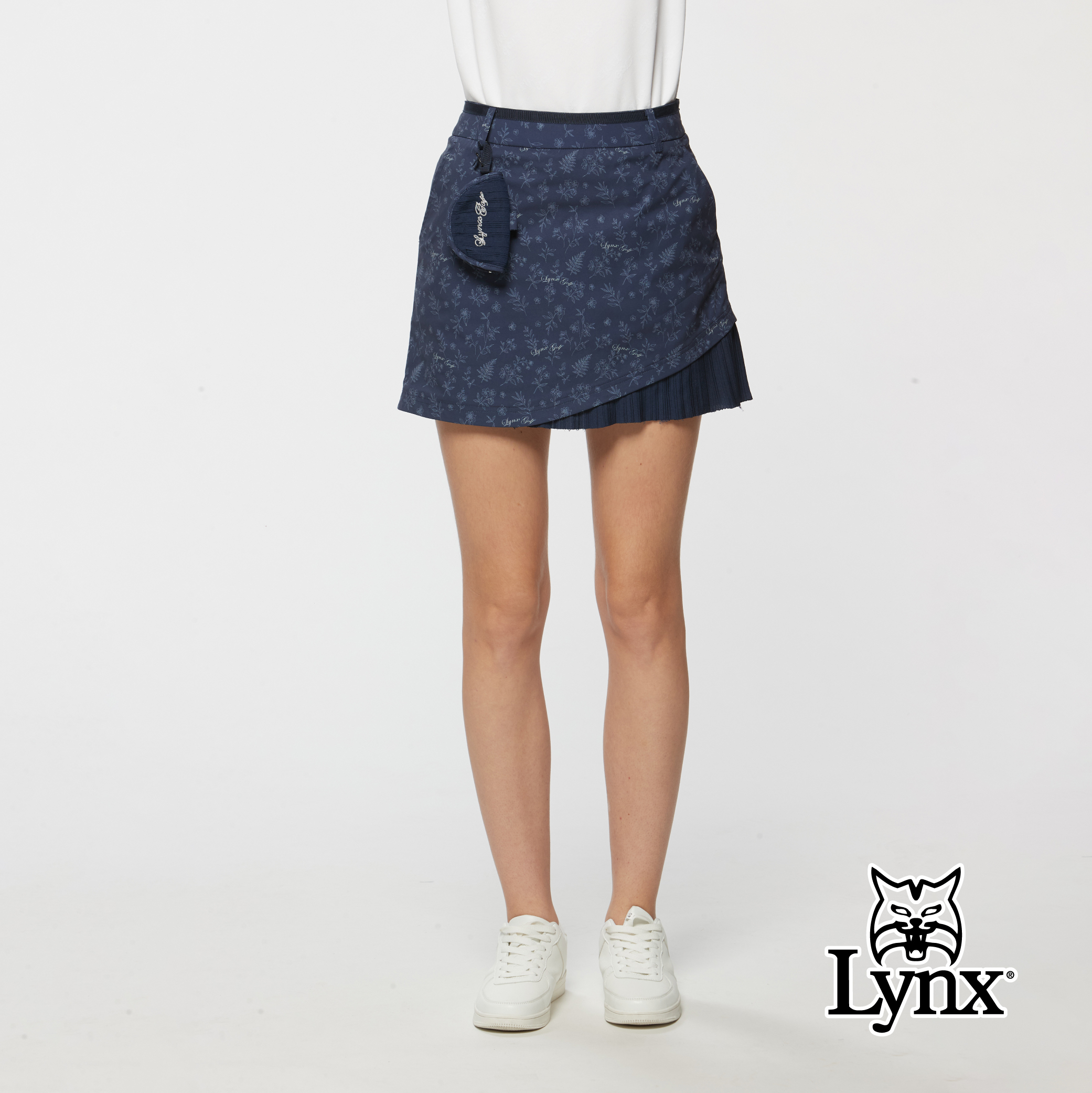 女款異材質剪裁造型碎花印花短裙/附小球包