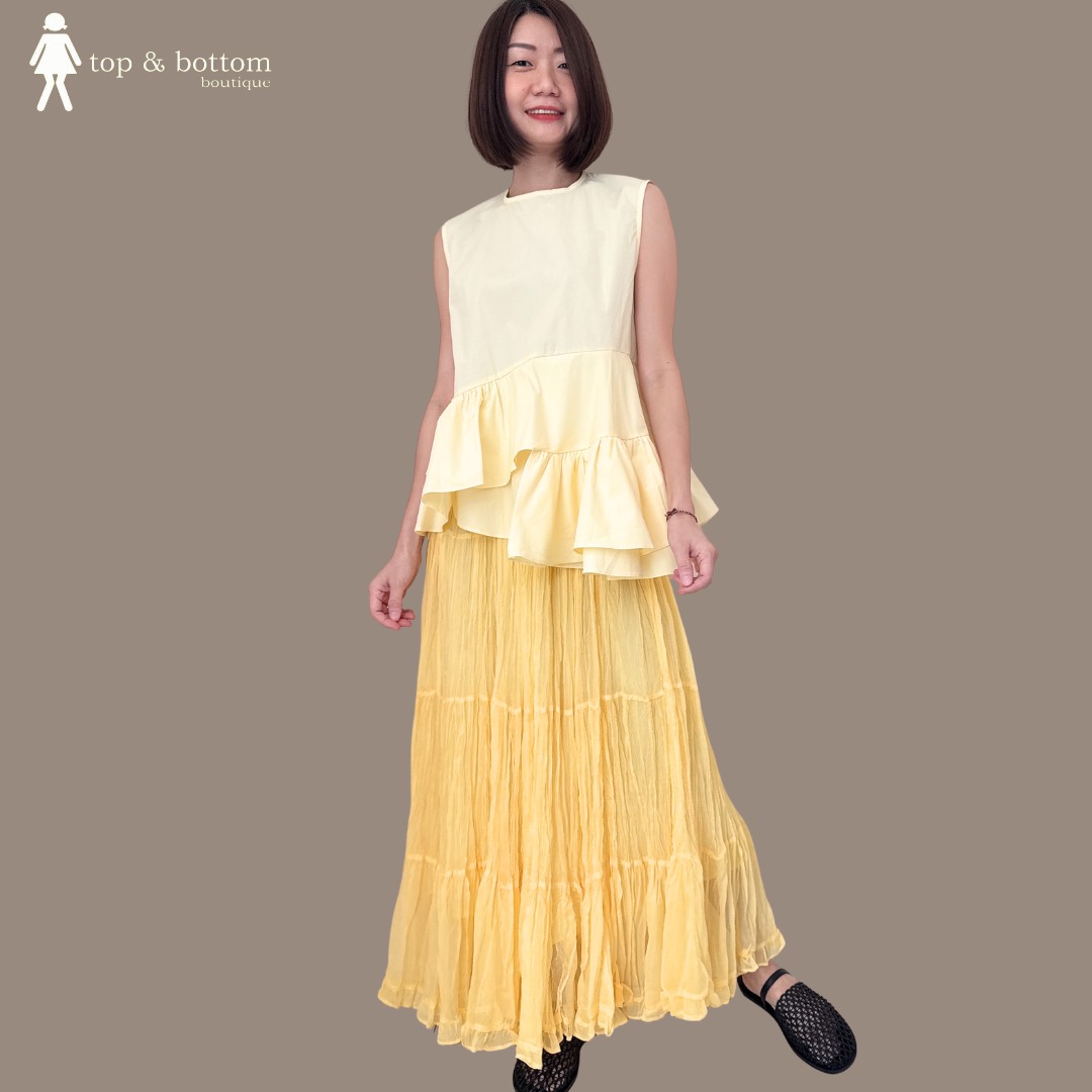 SLEEVELESS COTTON RUFFLED HEM BLOUSE