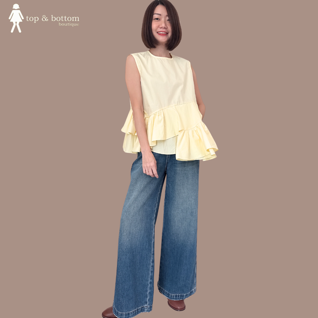 SLEEVELESS COTTON RUFFLED HEM BLOUSE