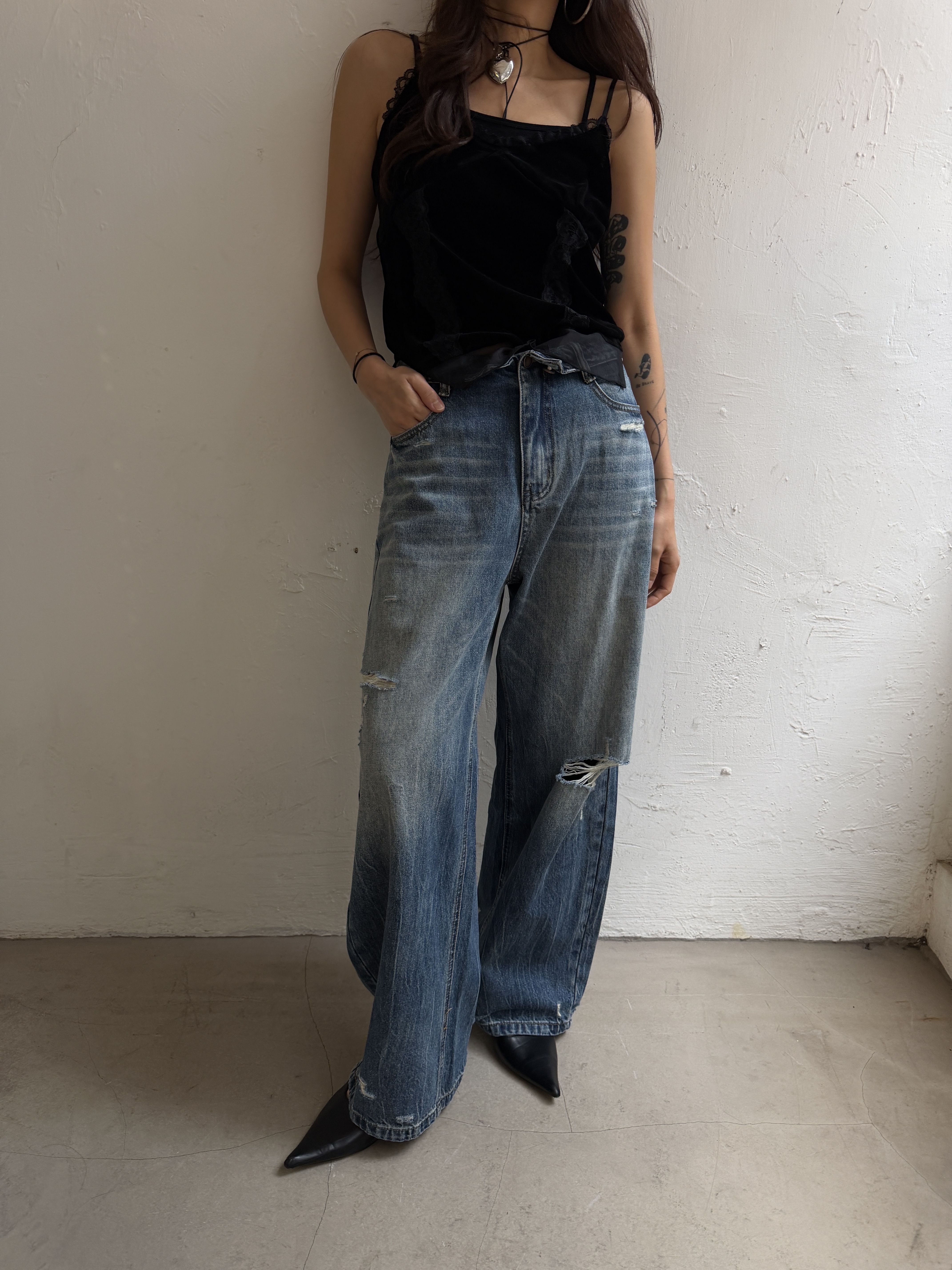 Reversed distress denim jeans