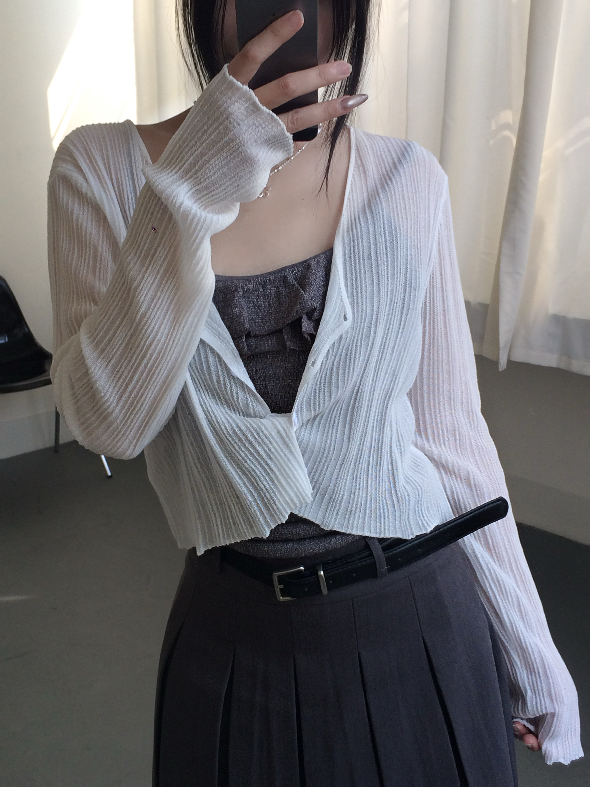 空氣感壓紋排釦小罩衫