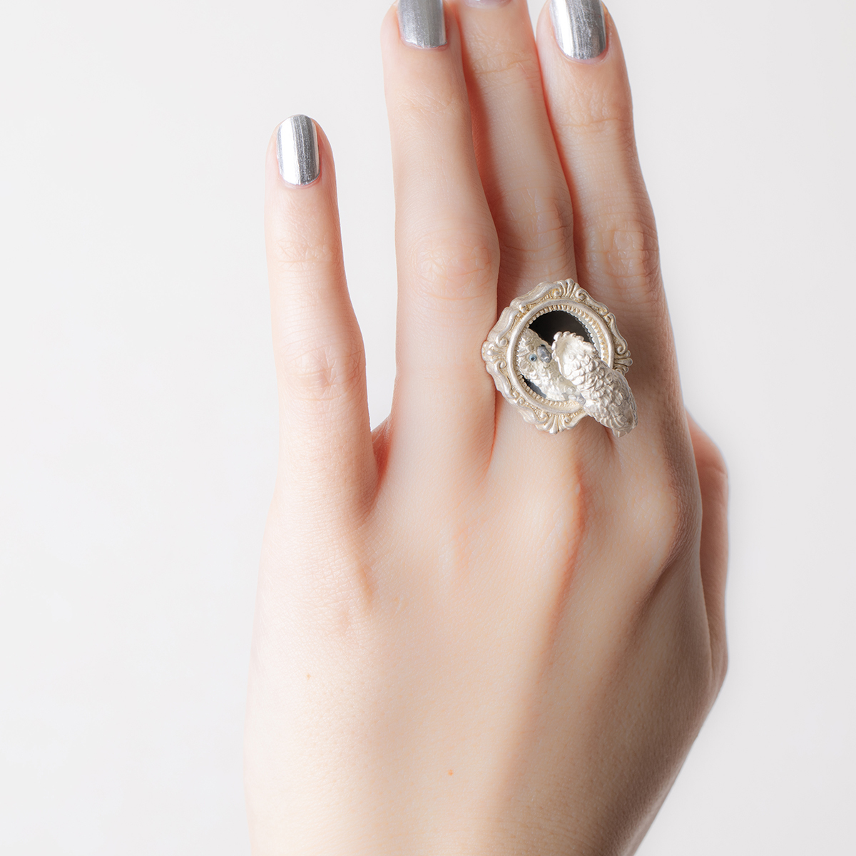 鸚鵡凝視鏡子戒指