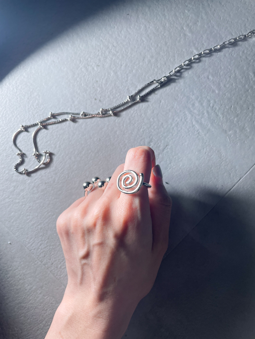 hand-drawn swirl ring
