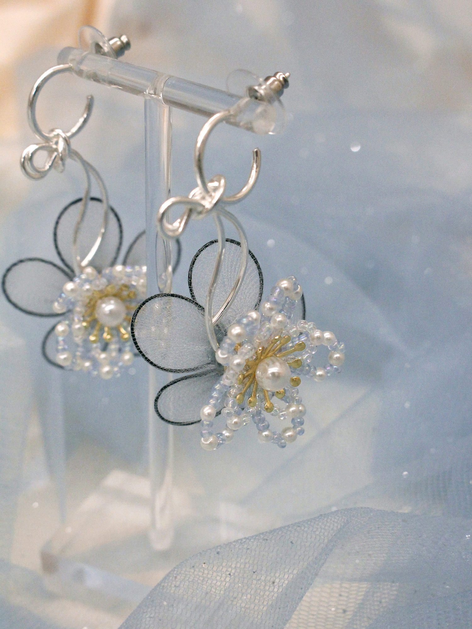 眯眯眼萬花筒。MUCHAT手作蝶結珠花純銀針耳環
