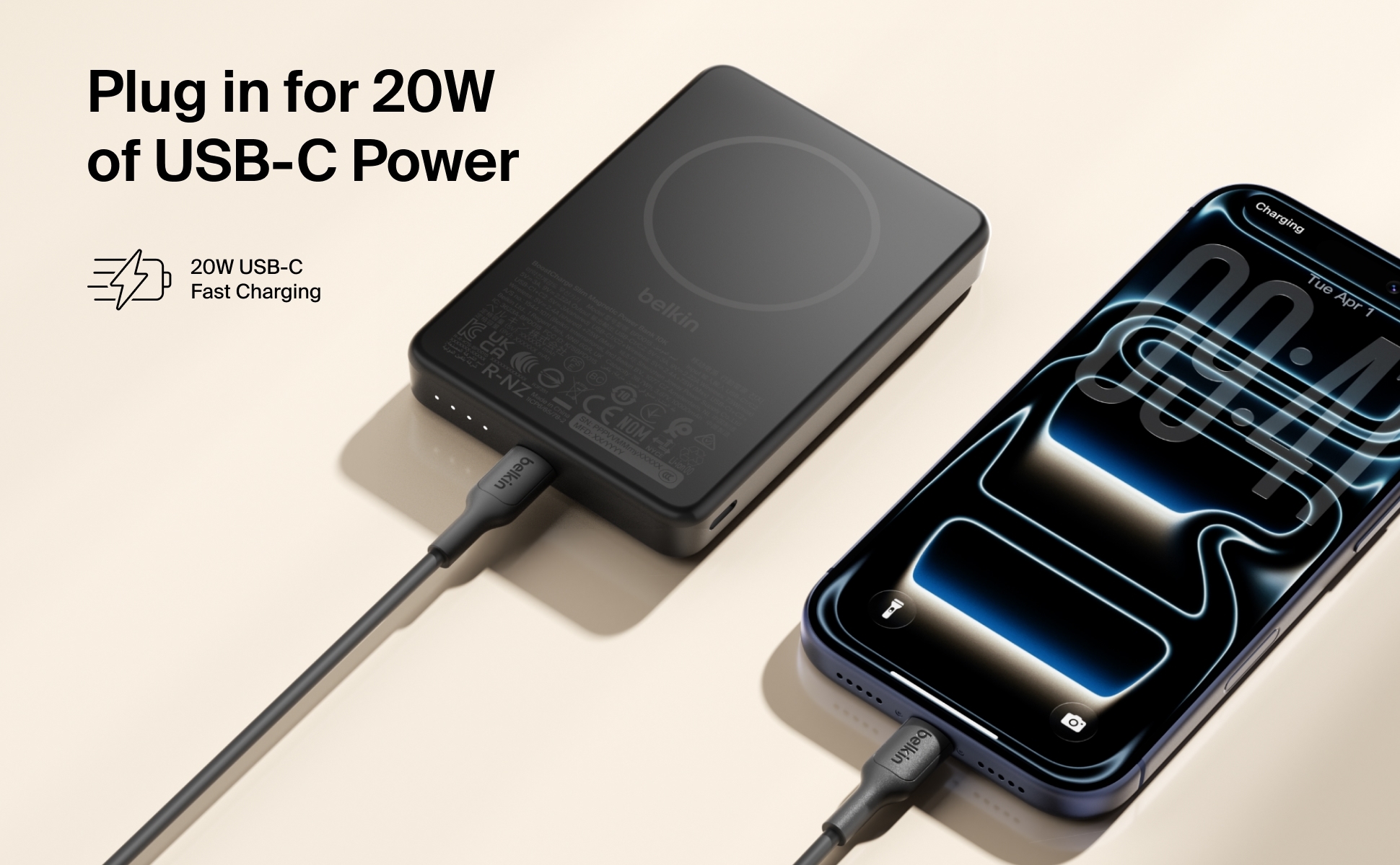 Belkin BoostCharge Slim Magnetic Power Bank 10K charging an iPhone wirelessly and two other devices via USB-C ports simultane
