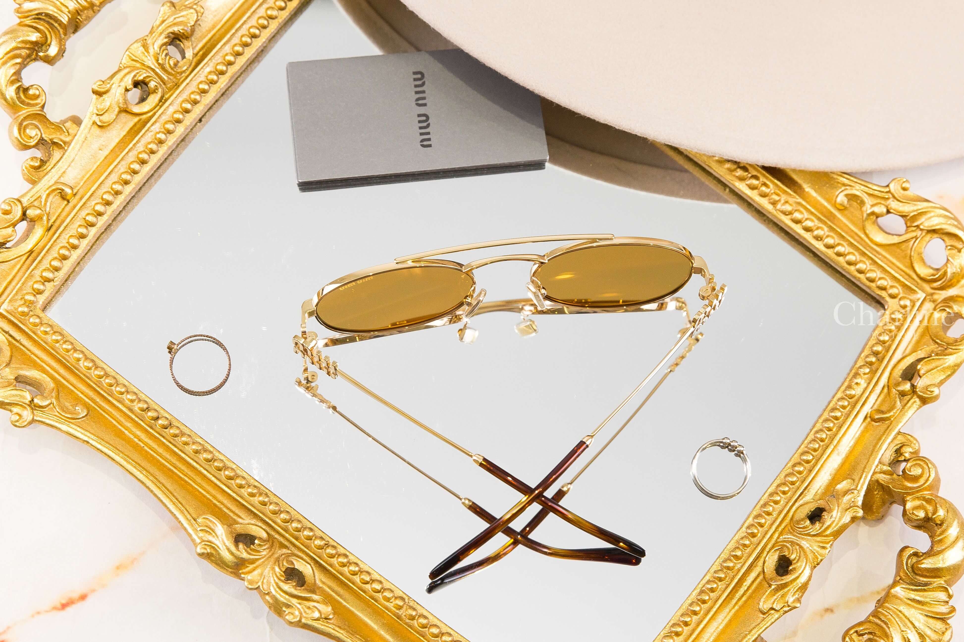 Miu Miu Sunglasses 金色橢圓框側邊金色字母琥珀色鏡腳太陽眼鏡-Charline Boutique 精品代購