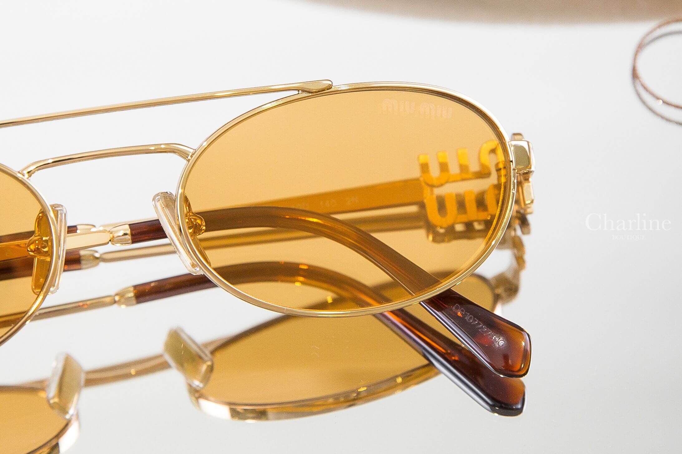 Miu Miu Sunglasses 金色橢圓框側邊金色字母琥珀色鏡腳太陽眼鏡