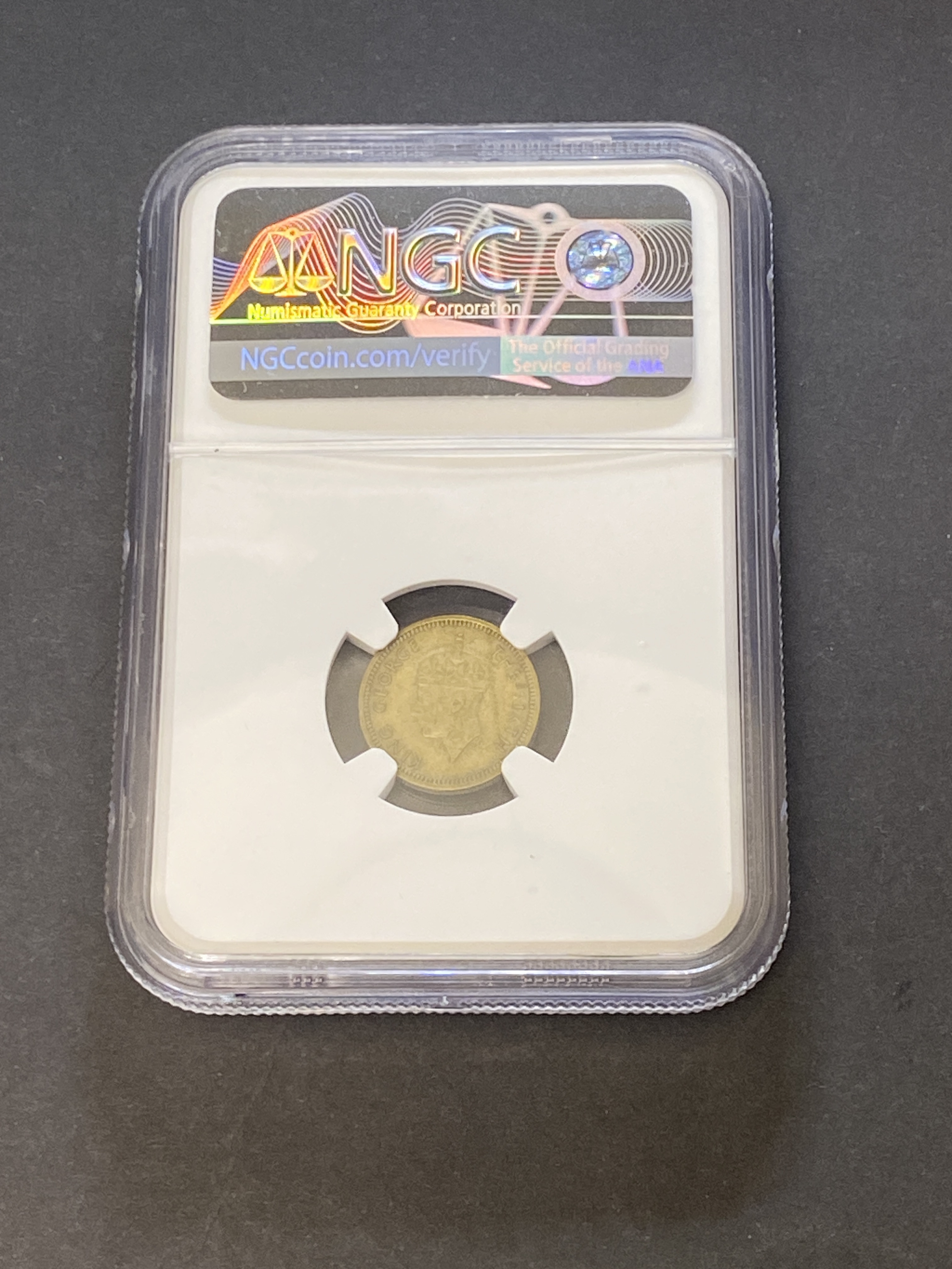 1949年喬治六世五仙 (NGC AU50) 錯體 - 壓印時被異物阻擋