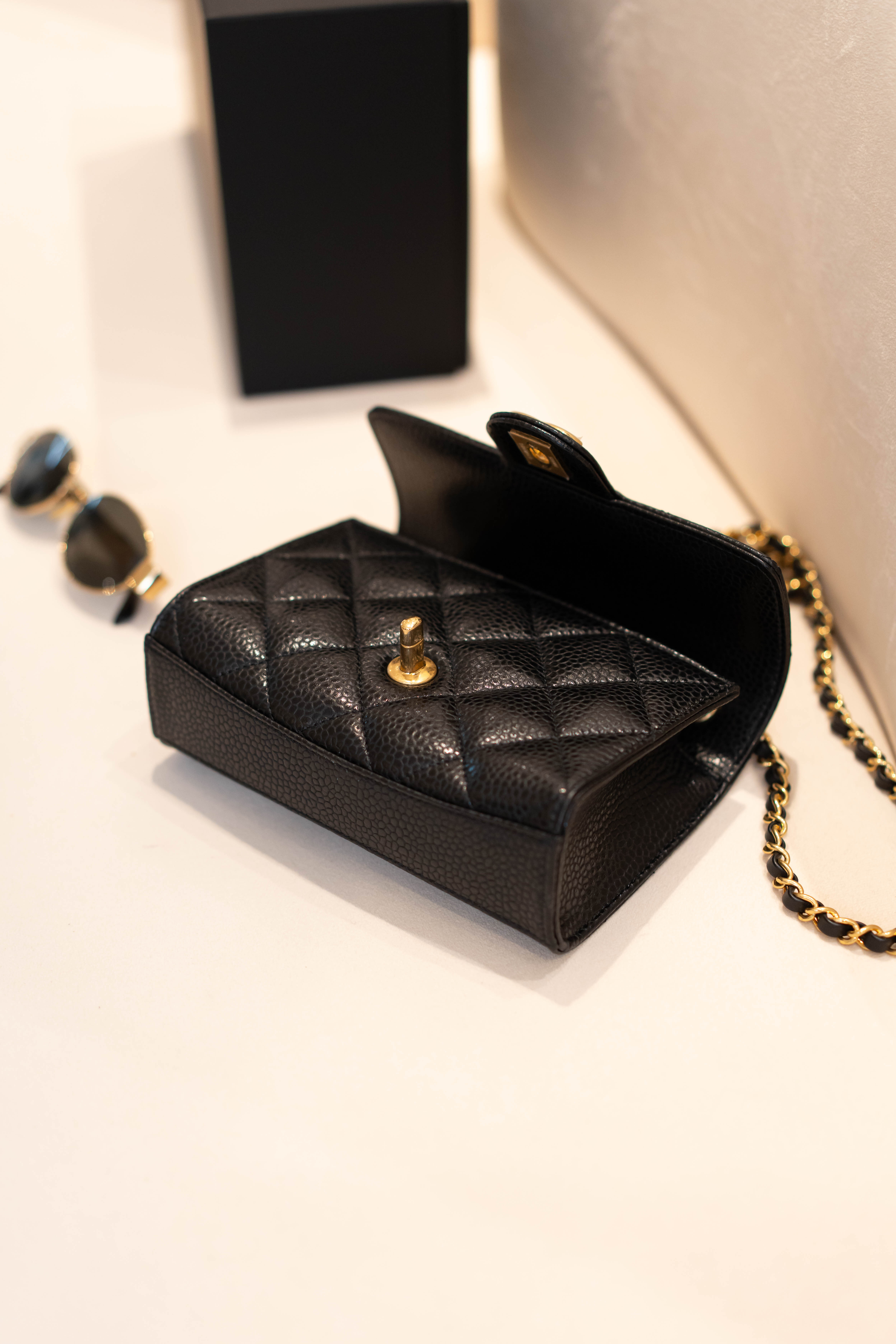 Chanel black mini flap black grained calfskin gold hardware