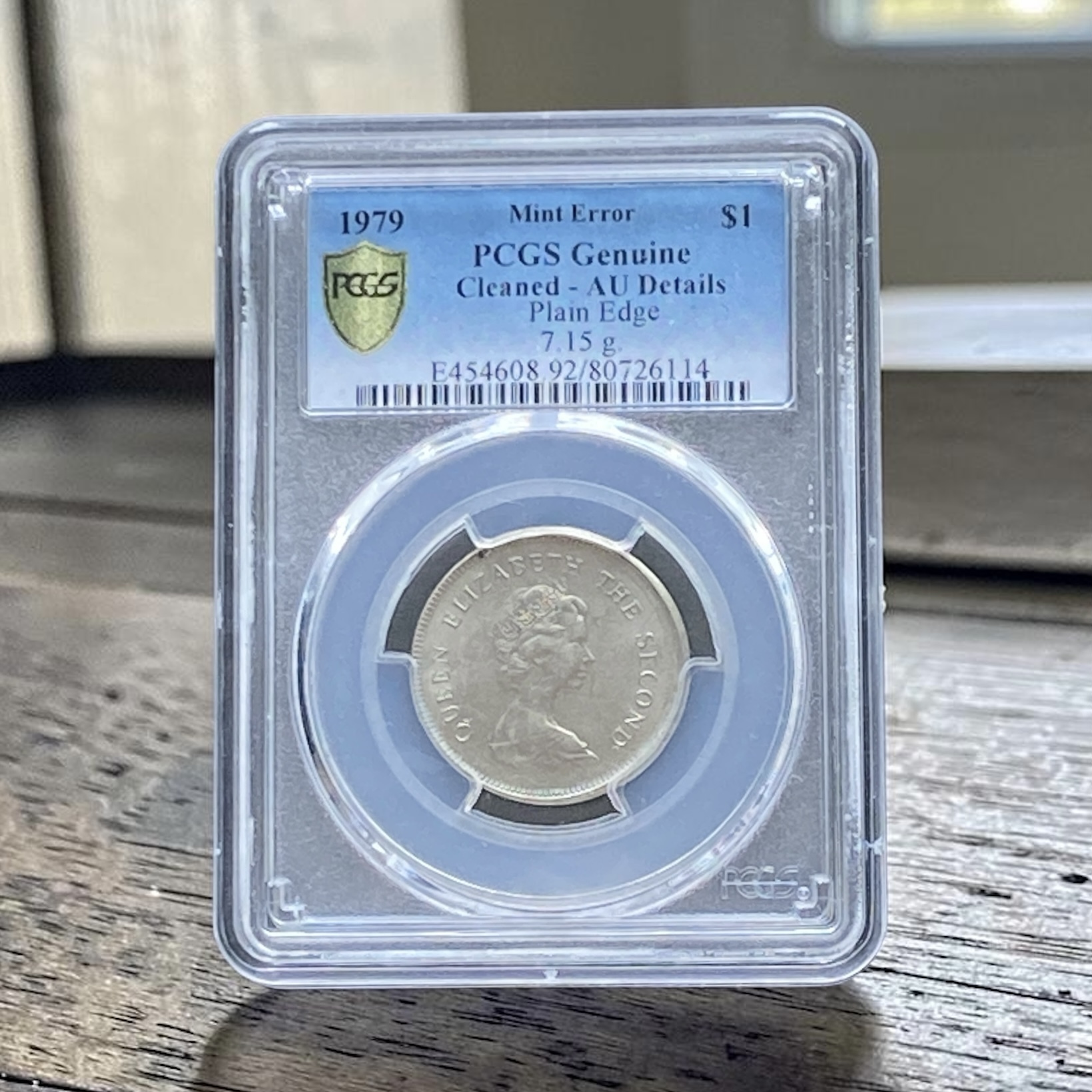 1979年伊利莎伯二世一元平邊錯體 (PCGS Cleaned - AU Details)