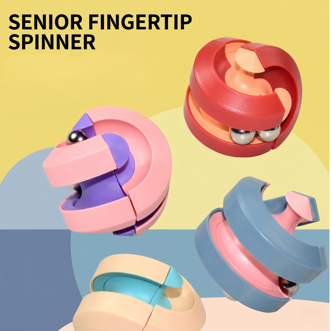 左上方印有英文字樣「SENIOR FINGERTIP SPINNER」，畫面展示四個不同配色、呈立體圓球結構的舒壓軌道陀螺。這款適合作為長者手部運動的樂齡玩具推介，分別有紅橘、粉紫、藍粉及米藍雙色拼接款式。每款表面均有圓弧交錯軌道，並帶有銀色滾珠，整體在黃藍粉拼接的幾何背景上，有助進行指尖細微運動訓練。