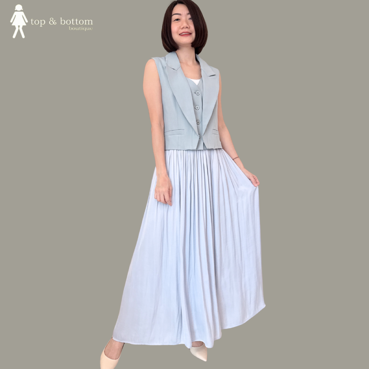 SLEEVELESS DOUBLE LAYERED VESTED BLOUSE