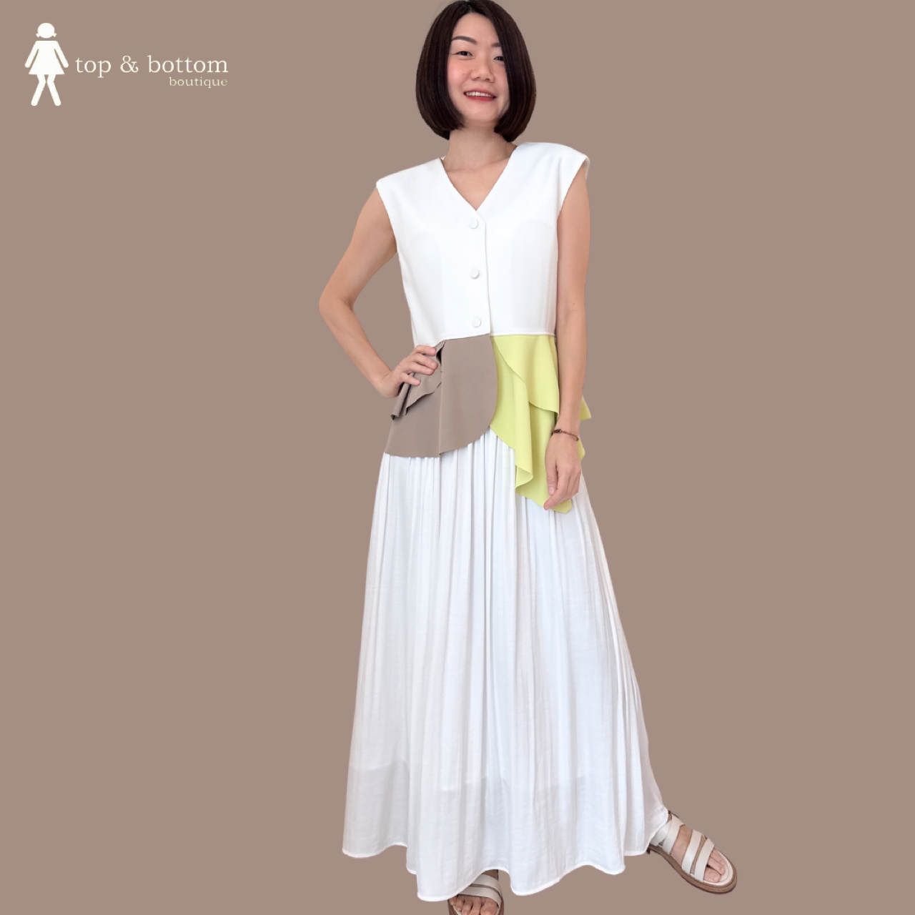 SLEEVELESS TWO TONE RUFFLED HEM BLOUSE