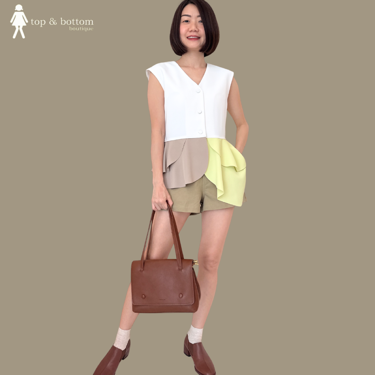 SLEEVELESS TWO TONE RUFFLED HEM BLOUSE