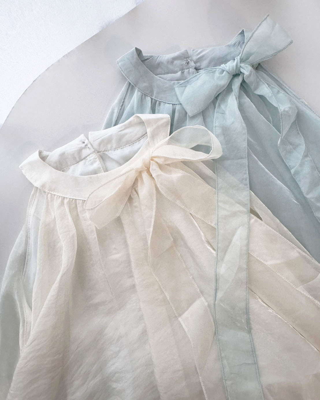 法朵Fado shop｜仙氣降臨🧚‍♀️微光蝴蝶結綁帶雙層澎澎上衣 0315015 兩色