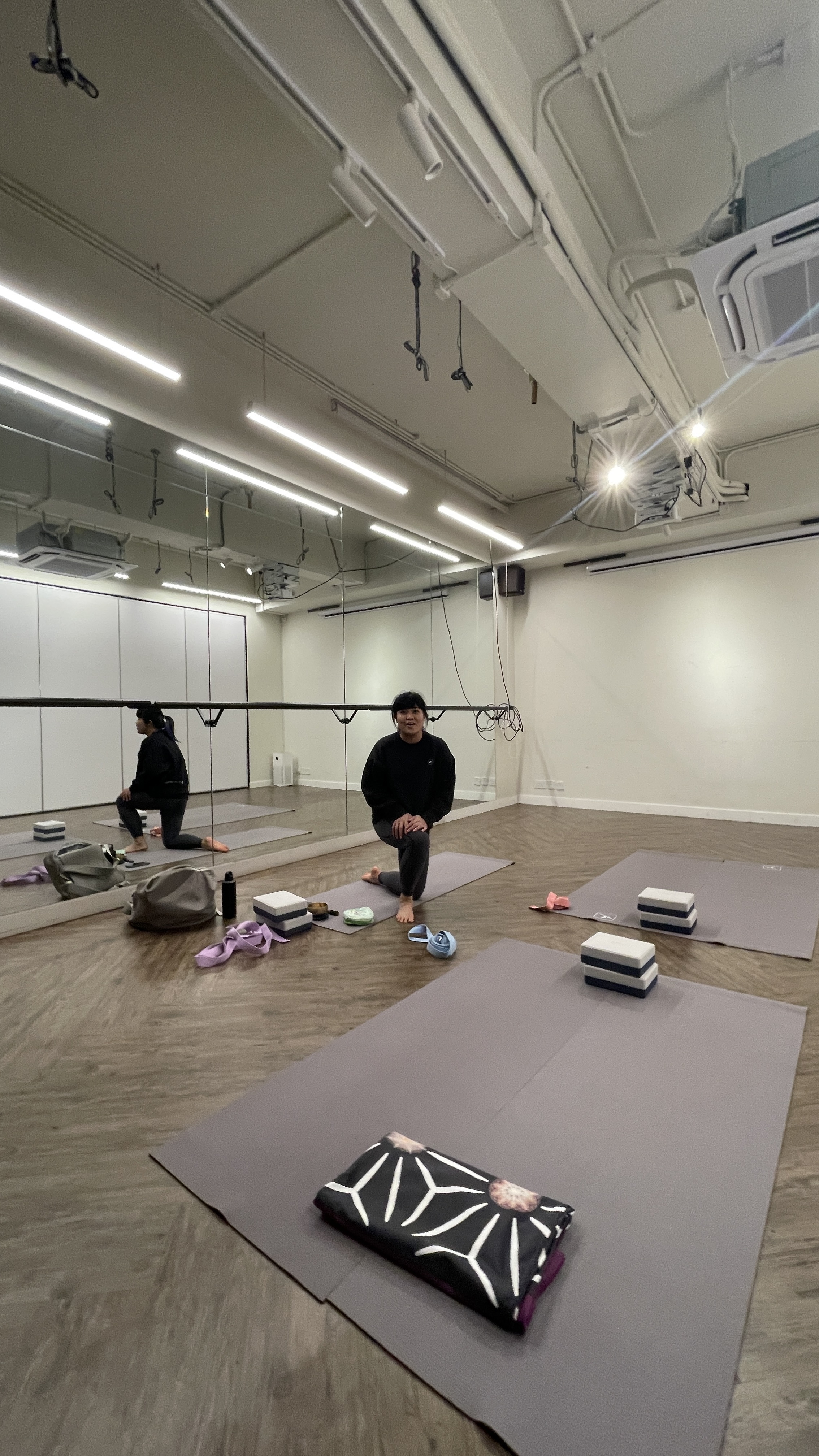Natalie Chan, our yoga tutor is facilitating a guided yoga session, focusing on body-mind support and mindful movement.
