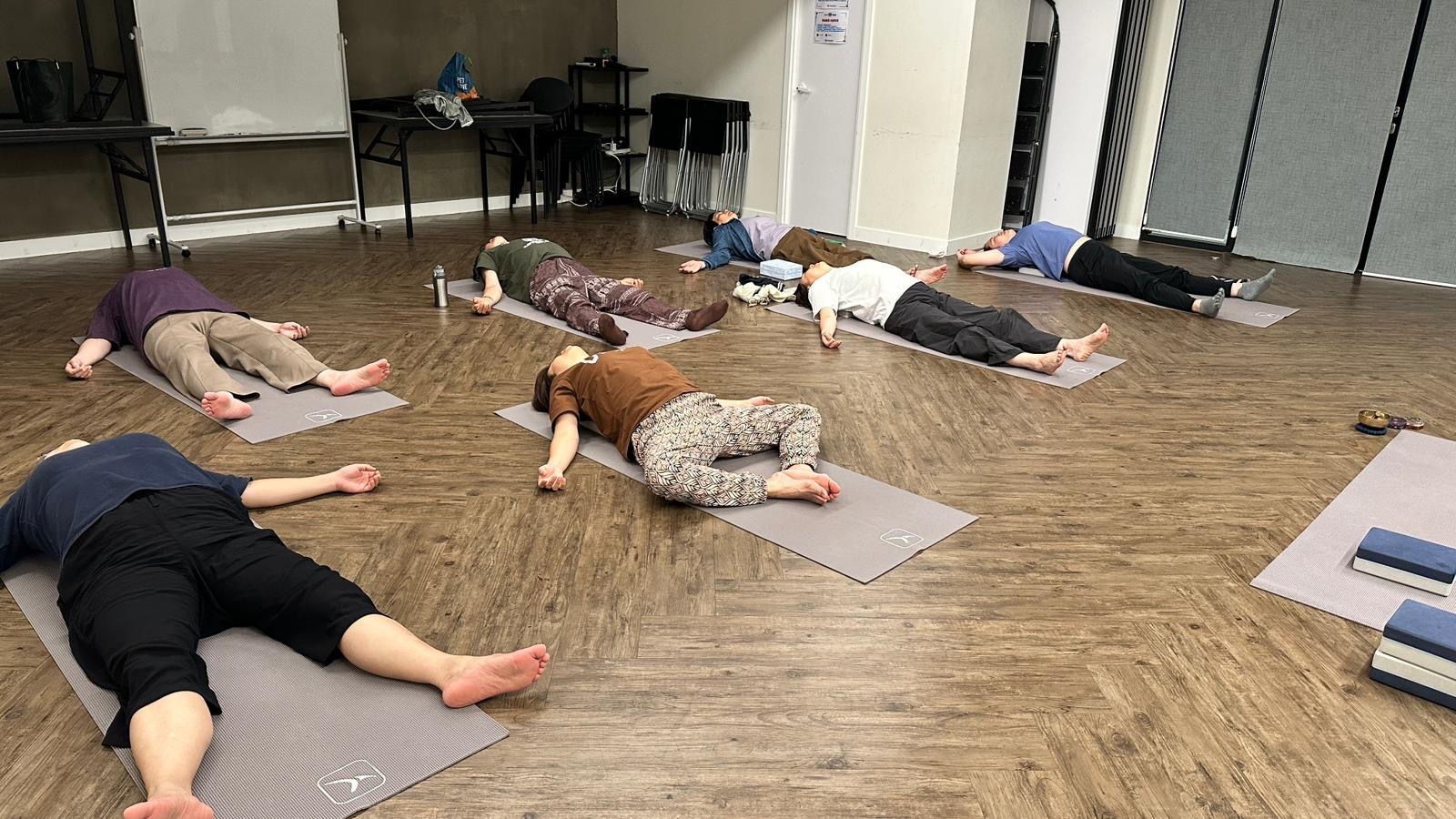 Yoga student is resting for an yin yoga post