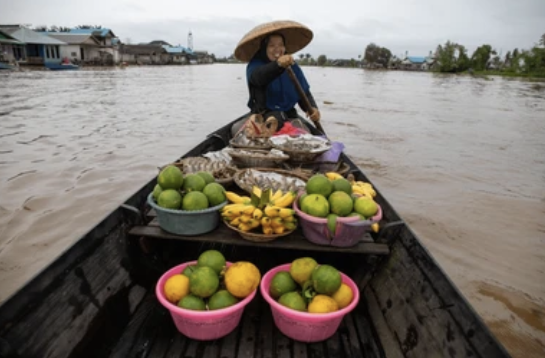 Sellers selling their goods at the floating market, Kalimantan