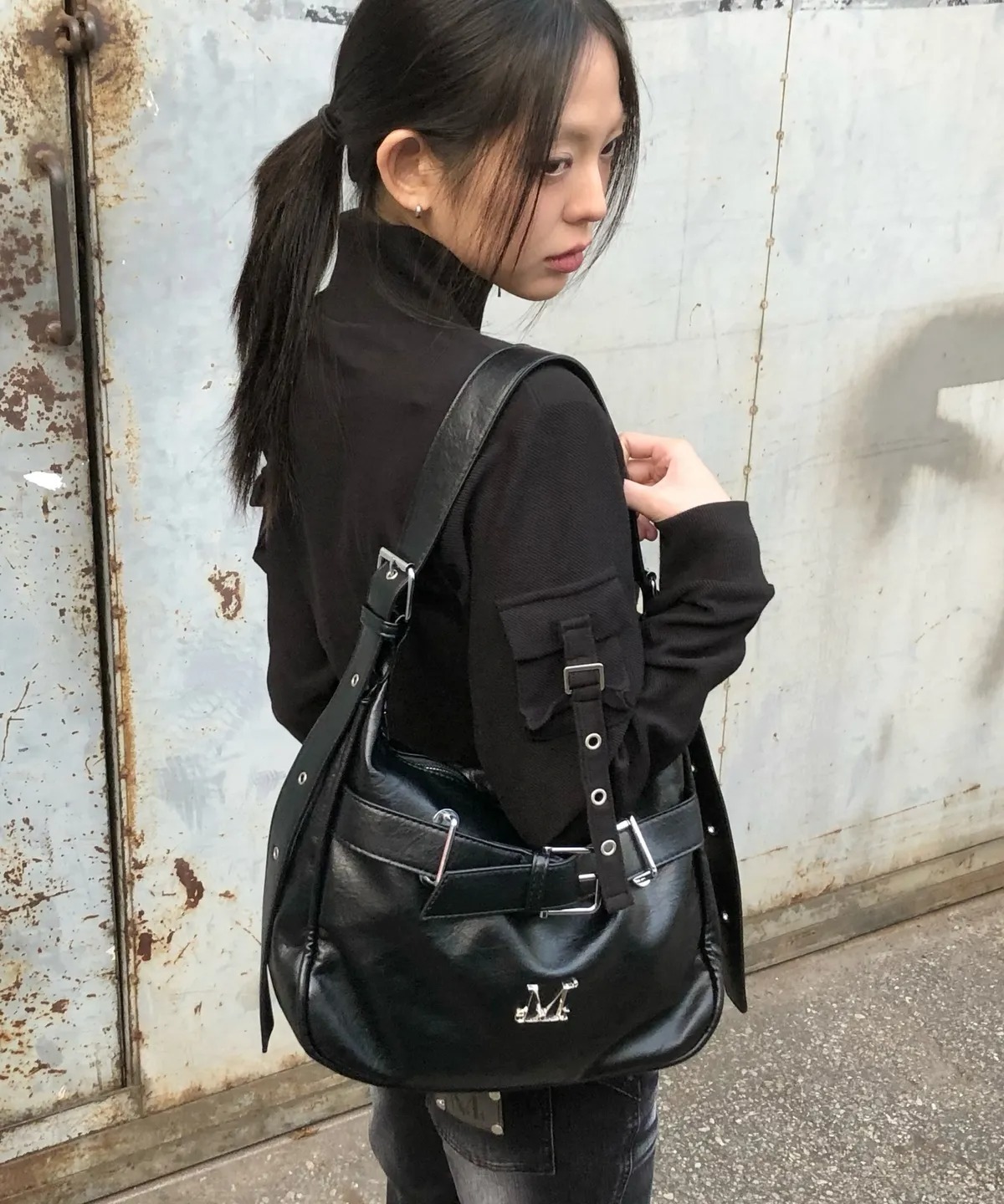 MUCENT MONIC METAL LOGO FRONT BELTED LEATHER SHOULDER BAG UNISEX