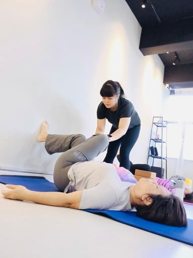 Natalie Chan, our yoga tutor is facilitating a guided yoga session, focusing on body-mind support and mindful movement.