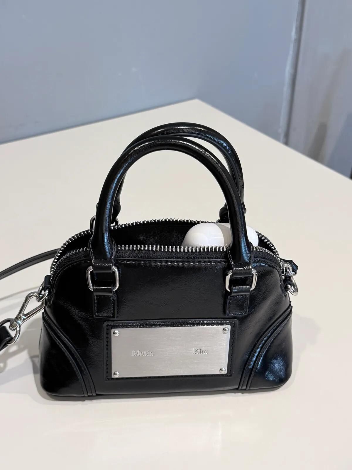 MATIN KIM CURVE ZIP MINI BAG