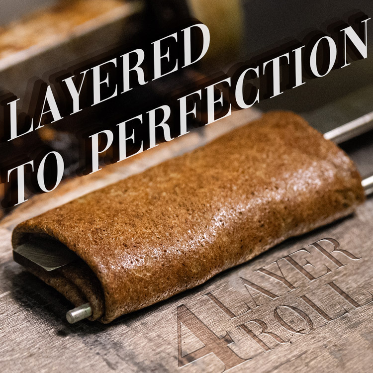 Fumi Roll 4-layer roll technique — layered to perfection, freshly baked brown sugar milk tea roll being rolled by hand, the artisan craftsmanship behind this Taiwan souvenir