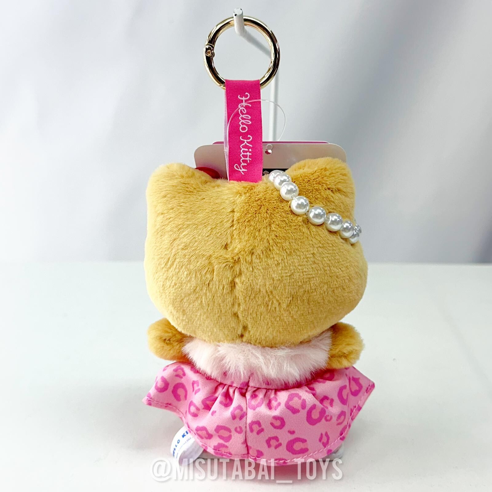 Sanrio Hello Kitty Suntanned Leopard Plush Keychain (Pink Dress)