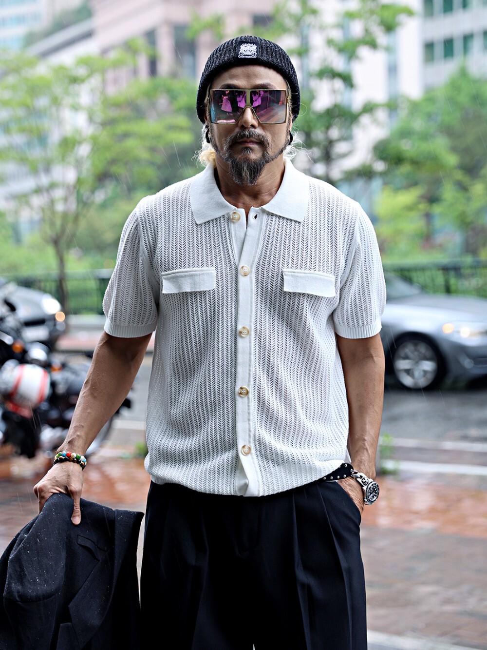 Short-sleeved knitted cardigan with perforated neckline