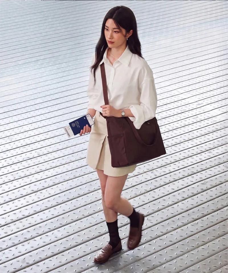 Woman walking confidently with the Branden Safe Days tote bag