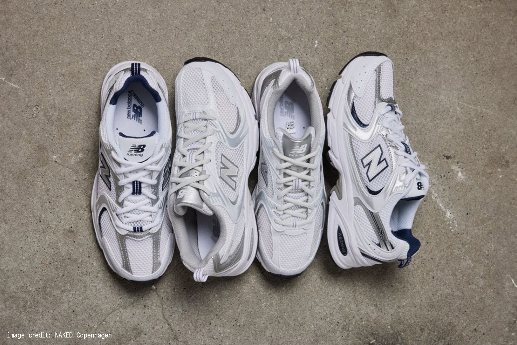 白色 New Balance 530，展現老爹鞋的網布與金屬皮革拼接質感