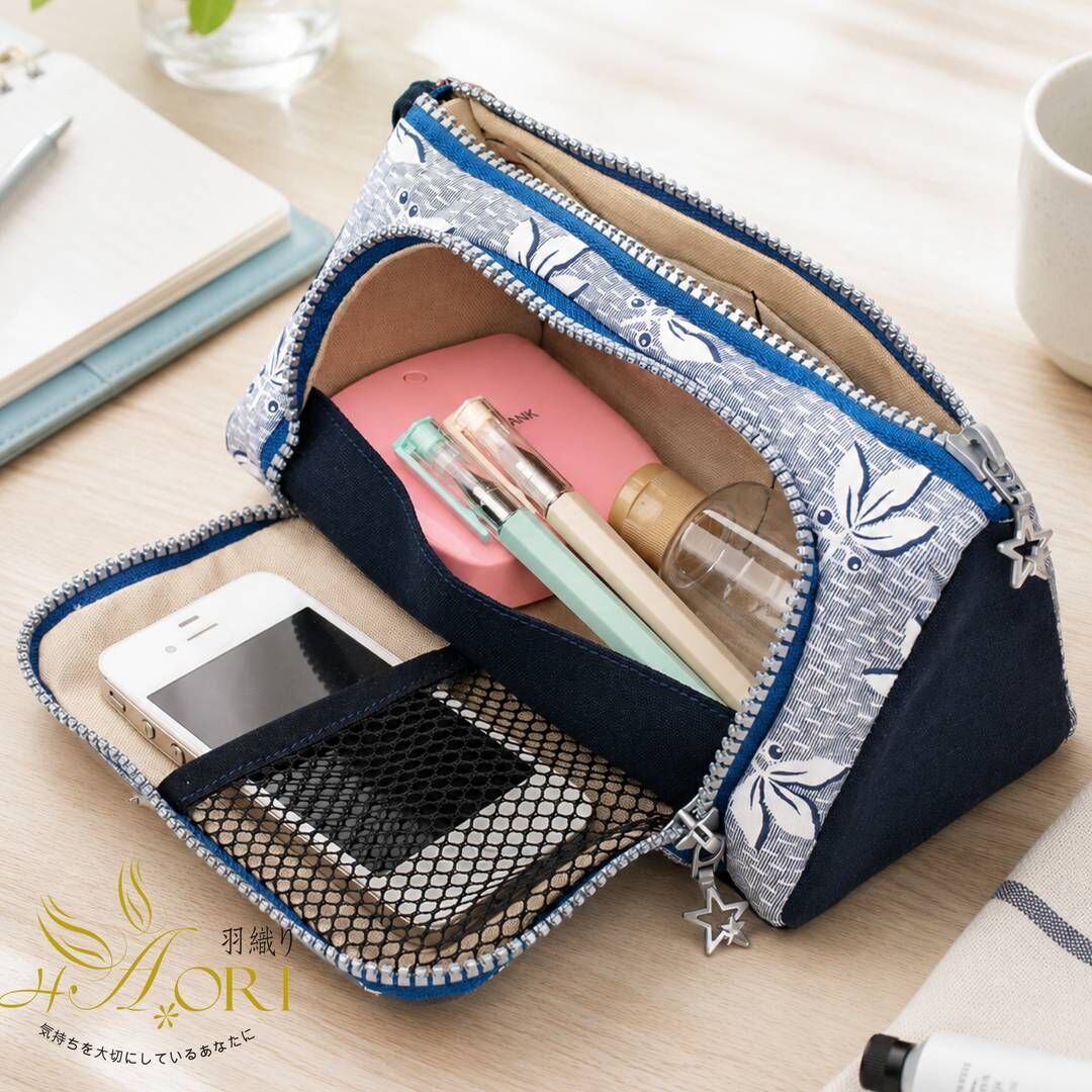 Top compartment and fold-down front section of double-zip organizer