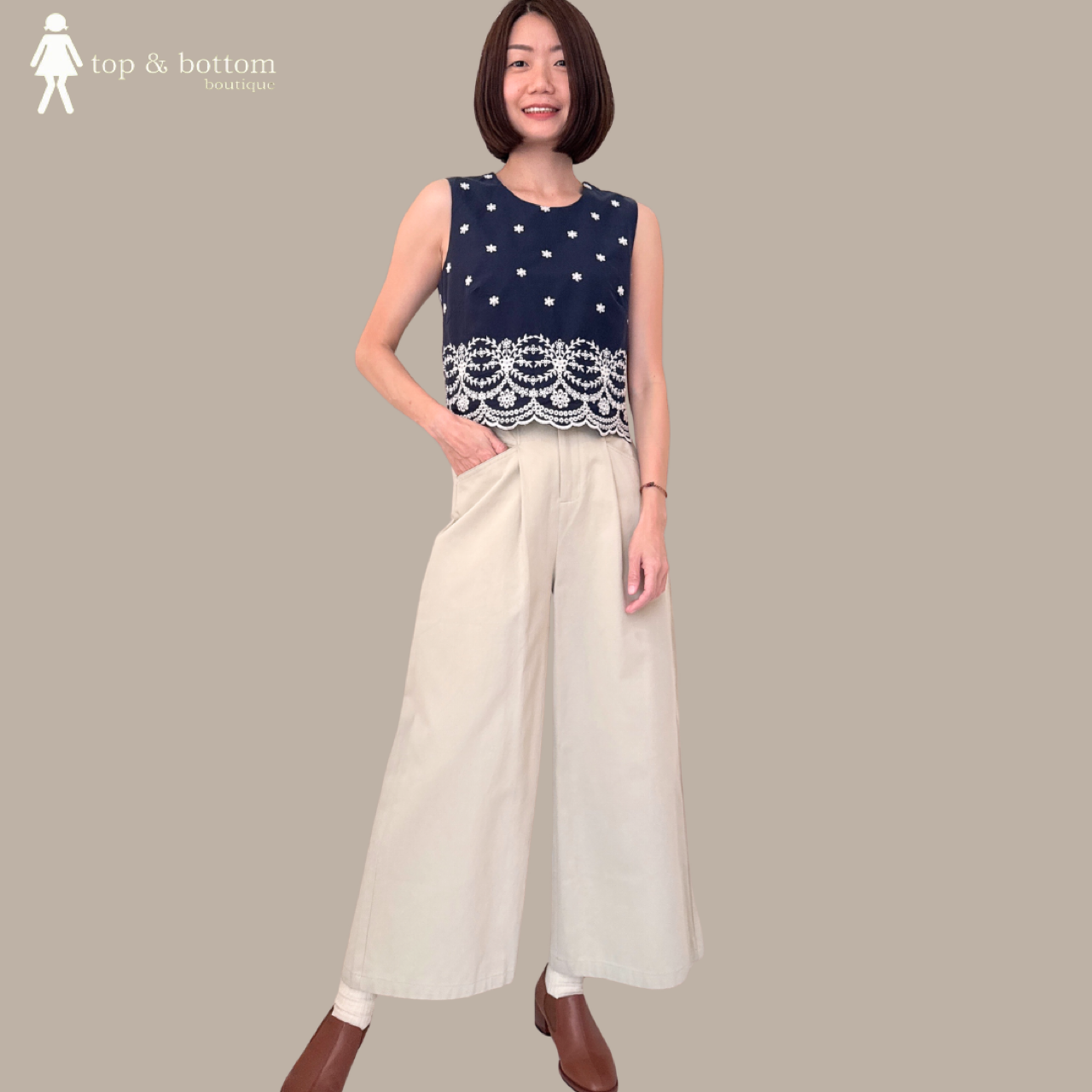 SLEEVELESS EMBROIDERED CROP TOP