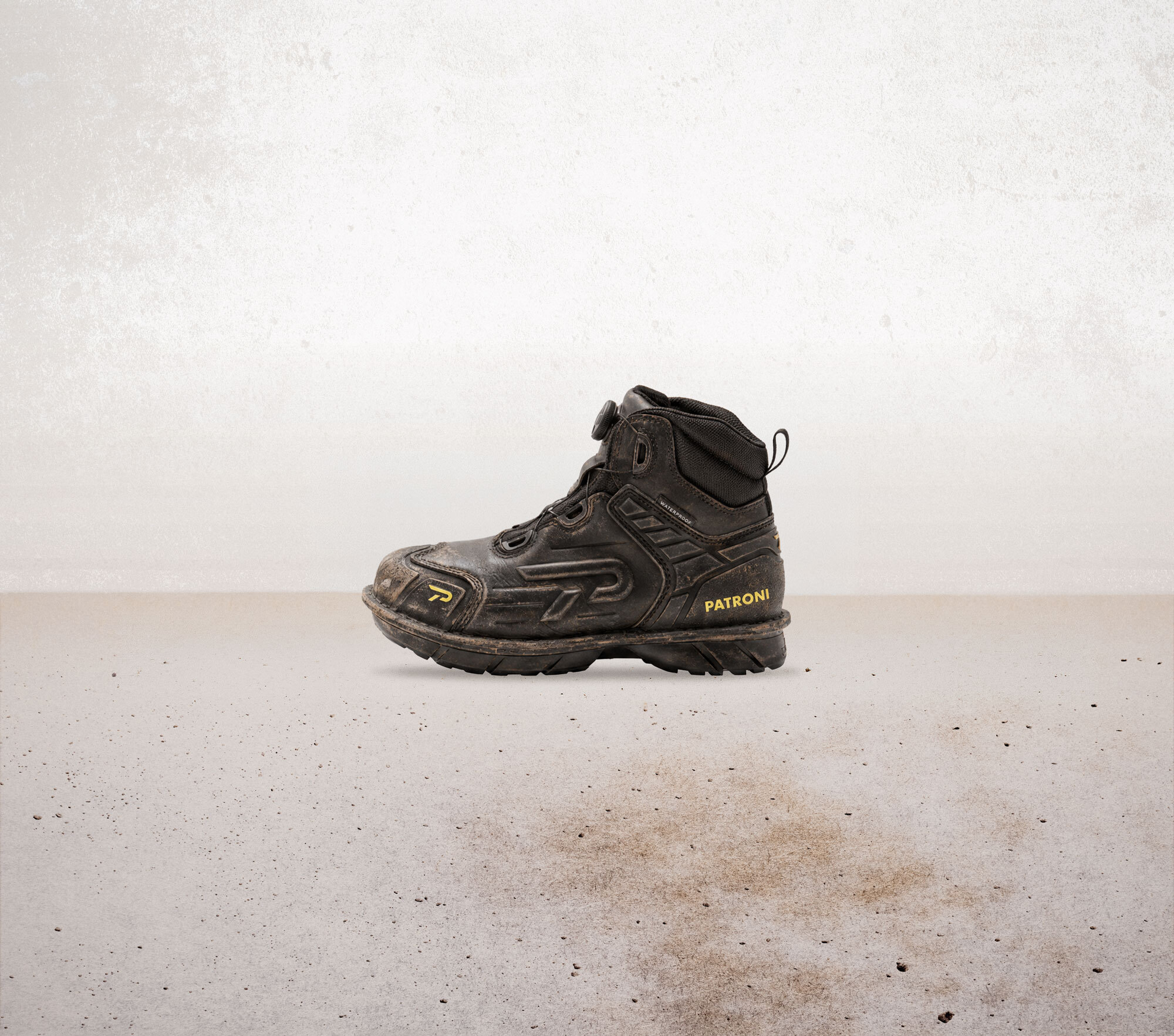 A black PATRONI SF2307 Warrior Boot on weathered ground, shown from new to worn as a durable companion through every shift