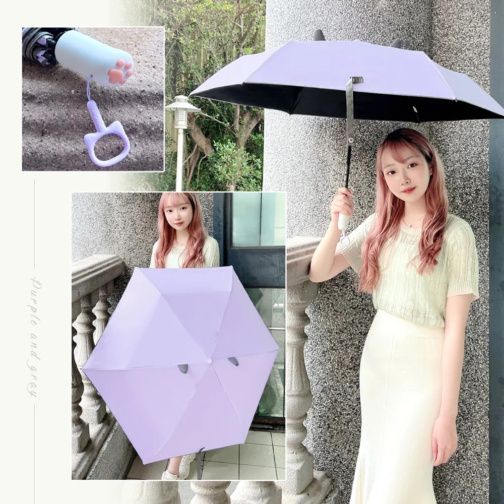 一名女性撐著紫芋貓款在陽台上，特別展示貓掌造型手把及傘面貓耳造型