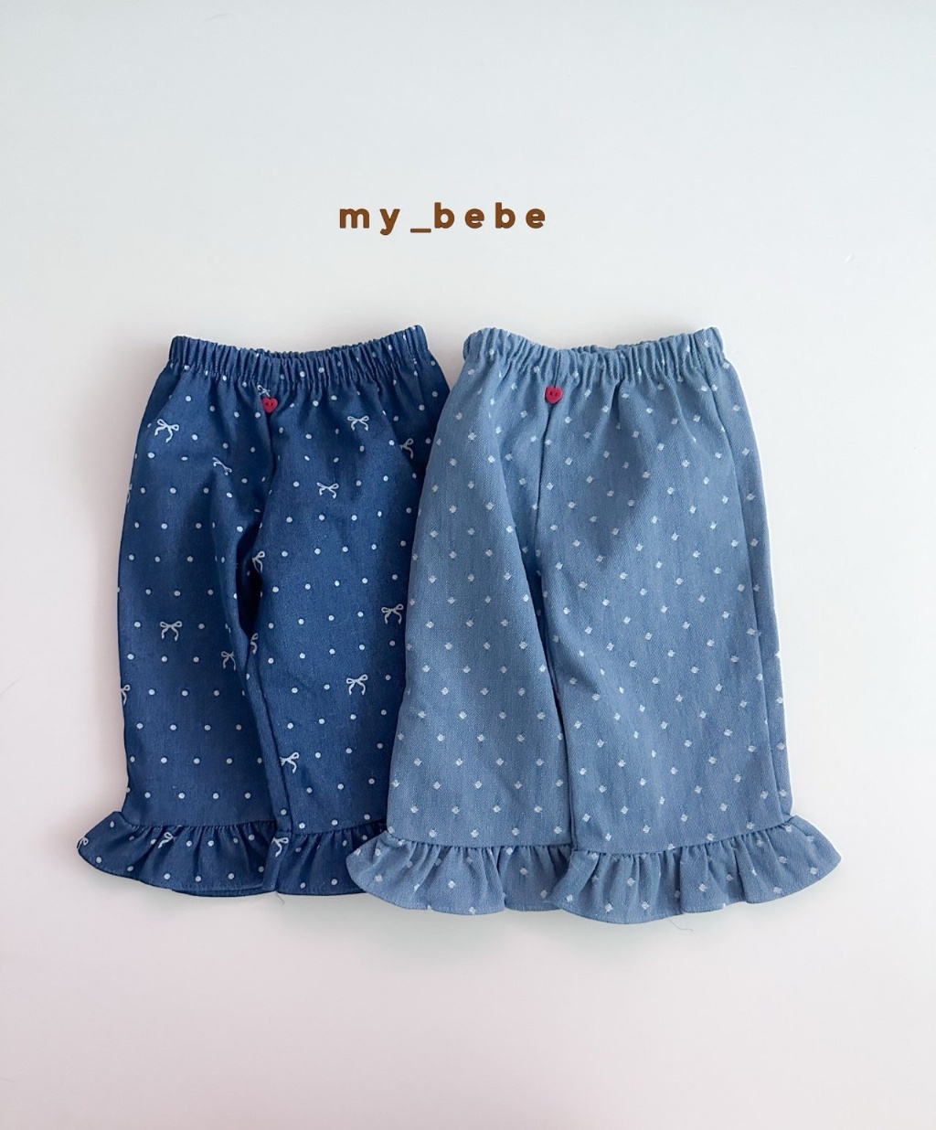 正韓秋Mybebe 愛心釦點點牛仔花邊褲
