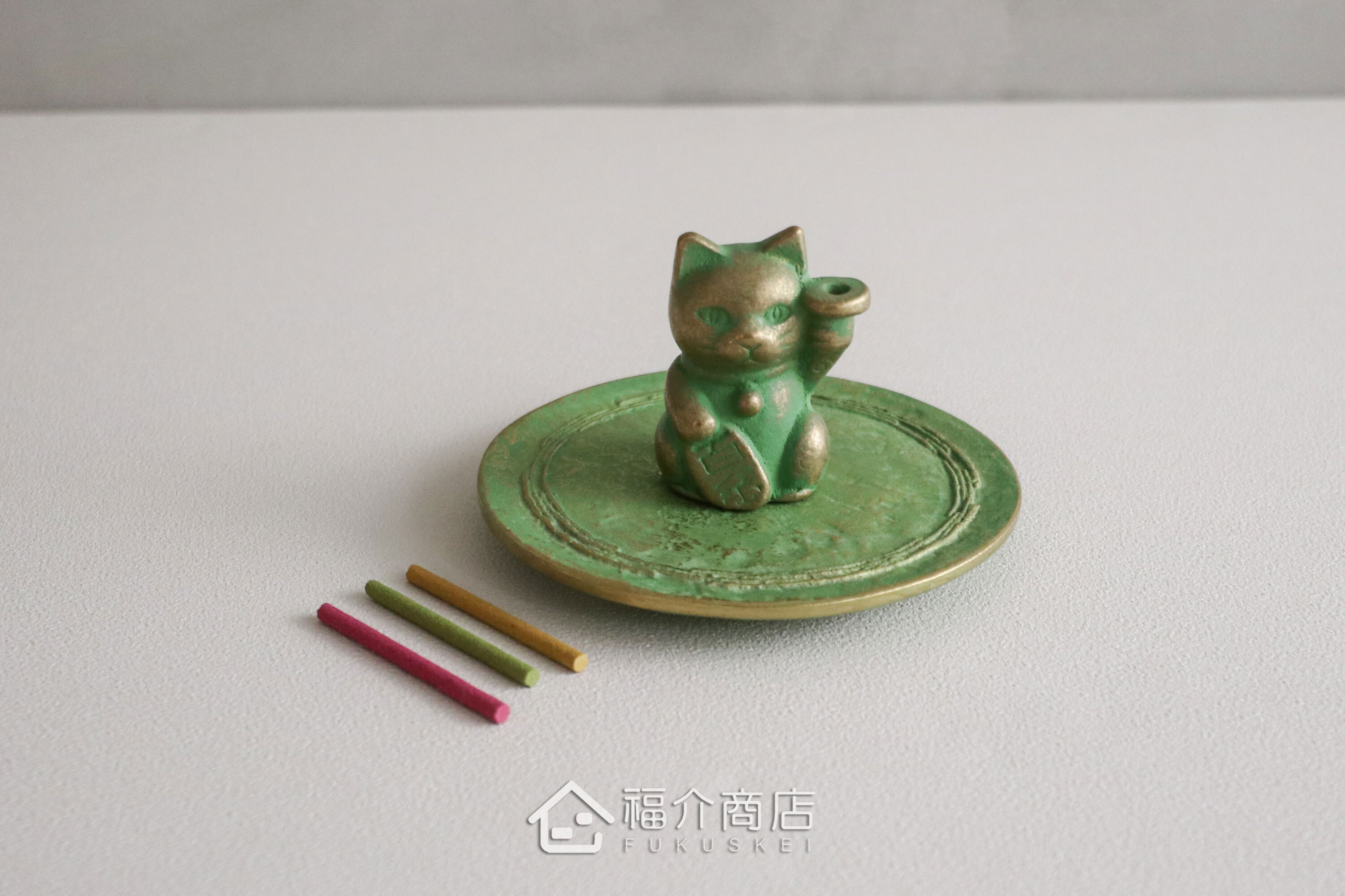 銅製招財貓造型的線香座