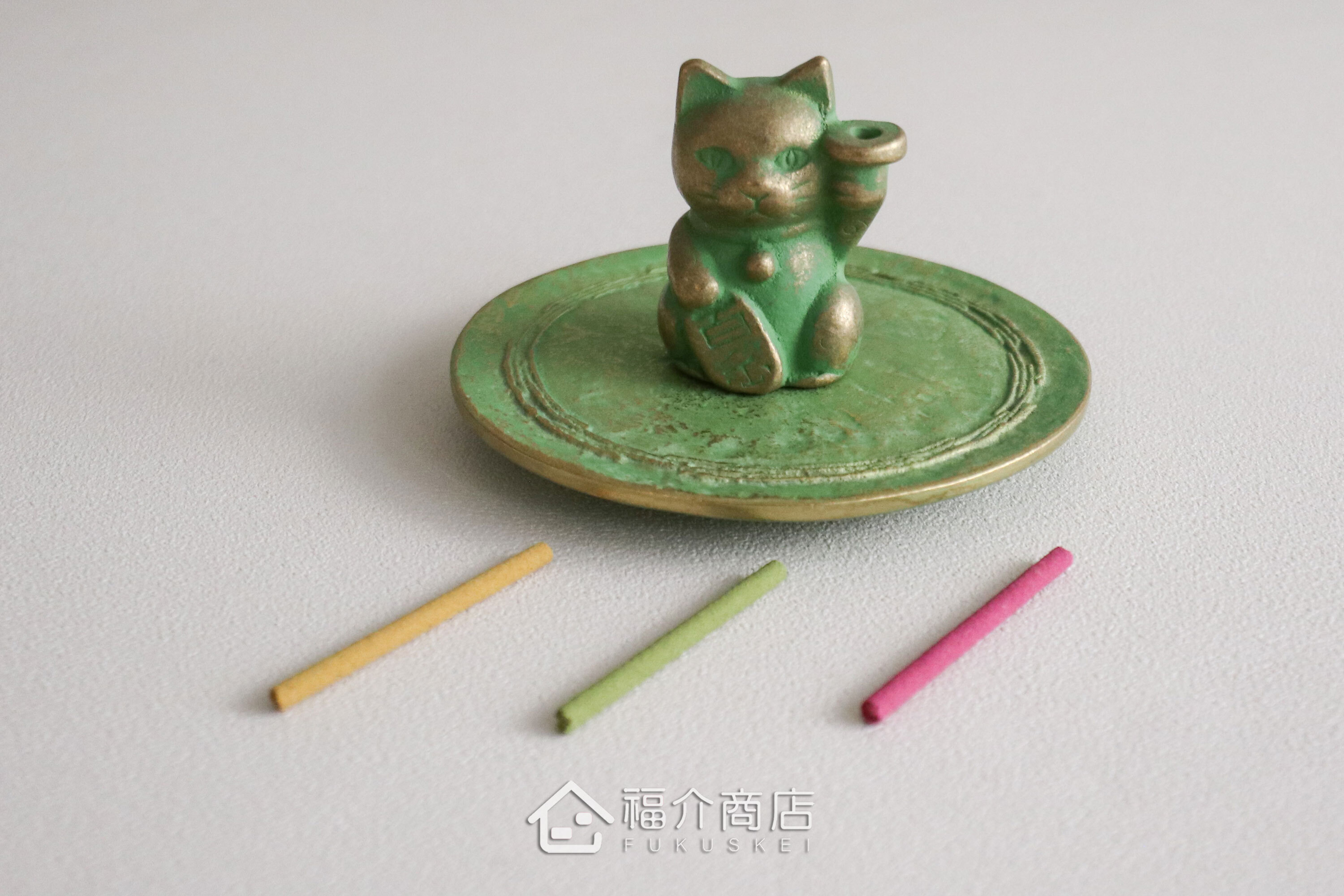 銅製招財貓造型的線香座