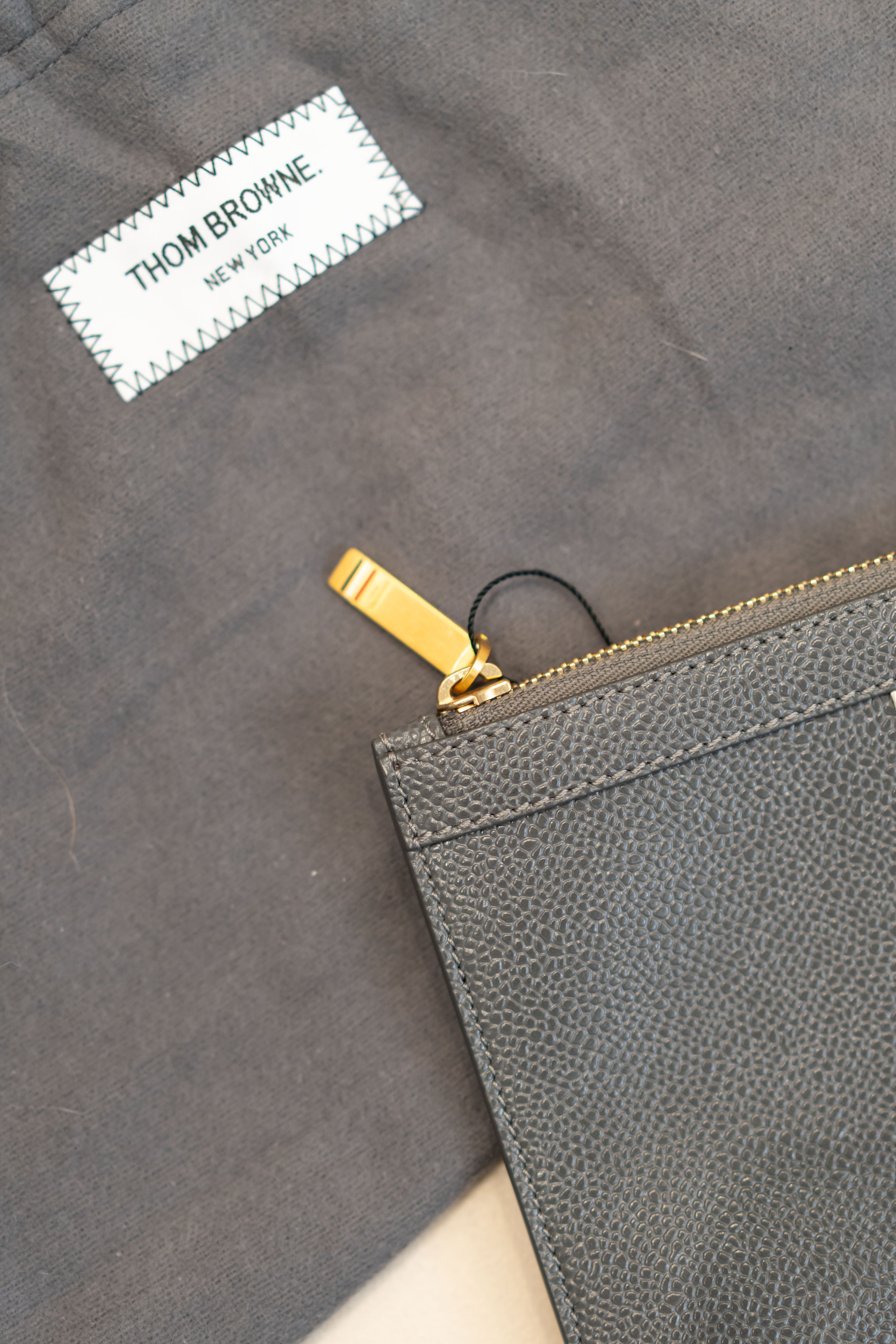 【全新閒置】Thom Browne 四條紋皮革手拿包