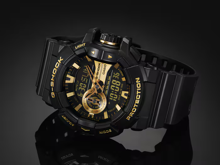 萬年鐘錶 - G-SHOCK  黑金元素雙顯休閒運動防震電子錶 GA-400GB-1A9  錶徑 : 51.9mm